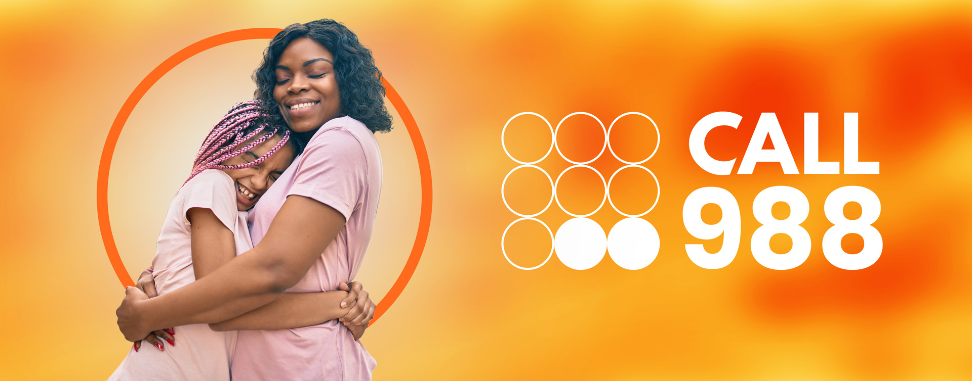 Woman and daughter hugging with 988 logo